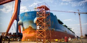 a-large-tanker-cargo-ship-is-being-renovated-and-painted-in-shipyard-dry-dock.jpg